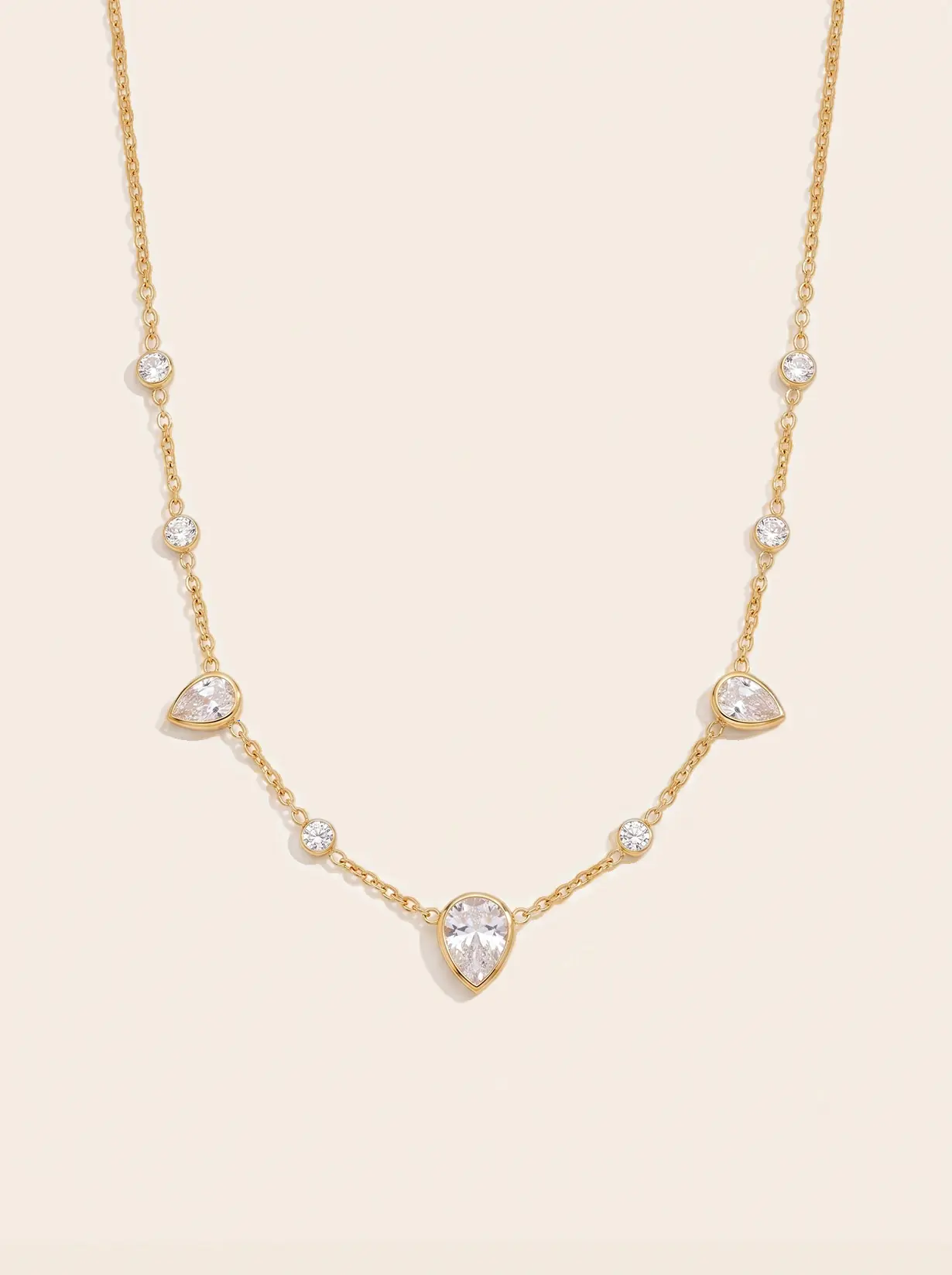 A gold-plated ALVANY necklace, kept bright with gentle care
